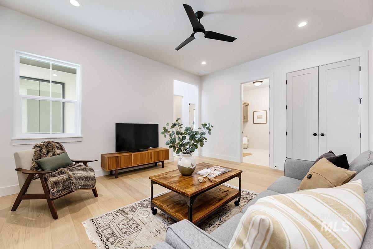7026 Saddle Bred Way Star, ID 83669 - Photo 25 of 49 Living room with light wood-style flooring, a ceiling fan, and recessed lighting