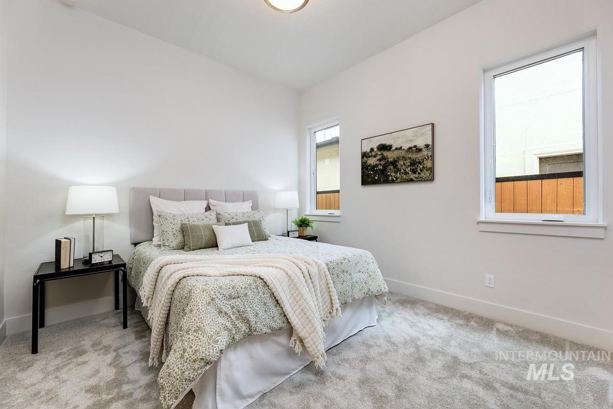 7026 Saddle Bred Way Star, ID 83669 - Photo 27 of 49 Bedroom featuring light colored carpet and lofted ceiling