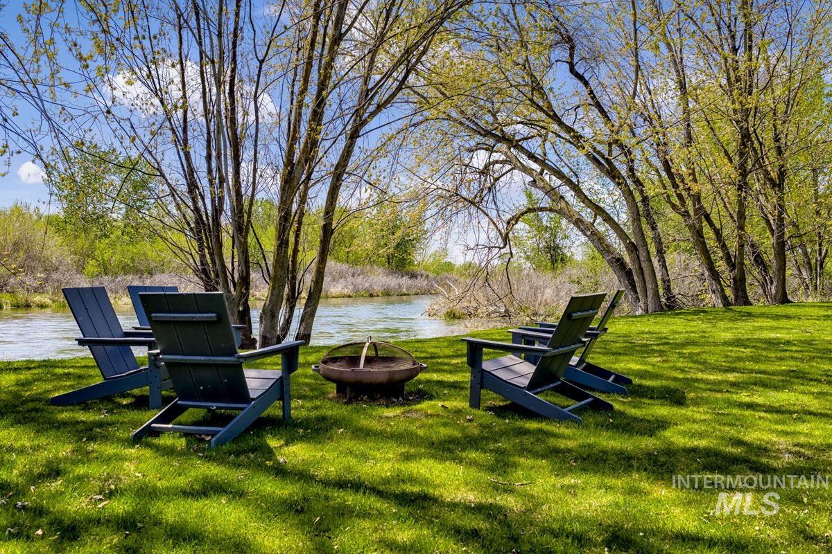 7026 Saddle Bred Way Star, ID 83669 - Photo 38 of 49 Expansive green lawn with mature trees and waterfront access