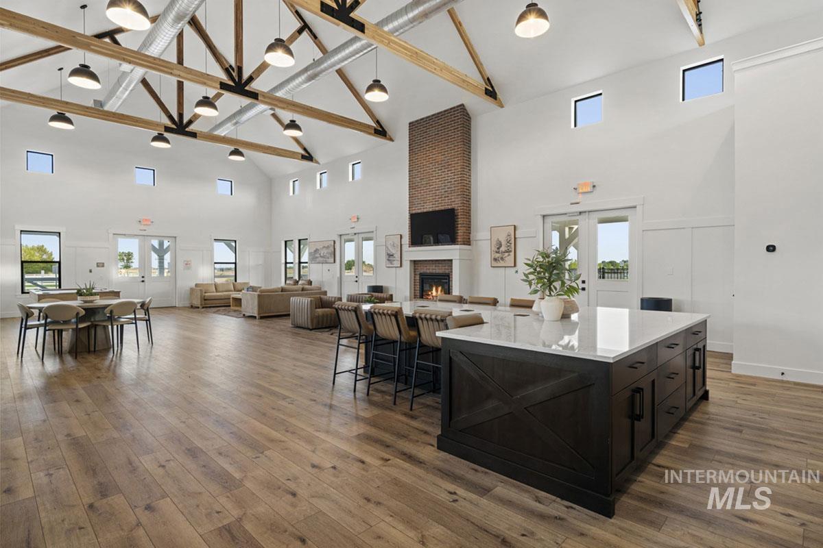 7026 Saddle Bred Way Star, ID 83669 - Photo 44 of 49 Vaulted ceilings with exposed wood beams and industrial pendant lighting