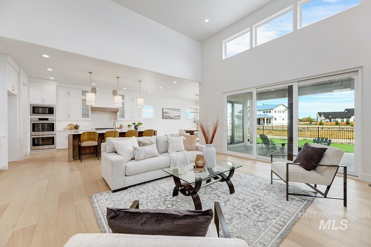 7026 Saddle Bred Way Star, ID 83669 - Photo 5 of 49 Living room with light wood-type flooring and recessed lighting