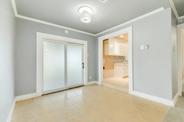 a view of an empty room and a window