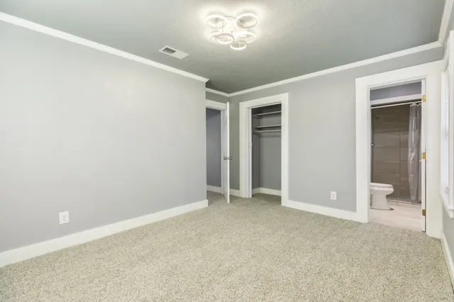 an empty room with a bathroom