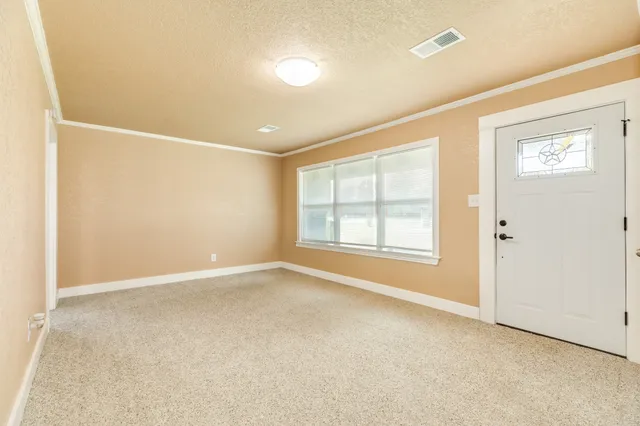 an empty room with windows