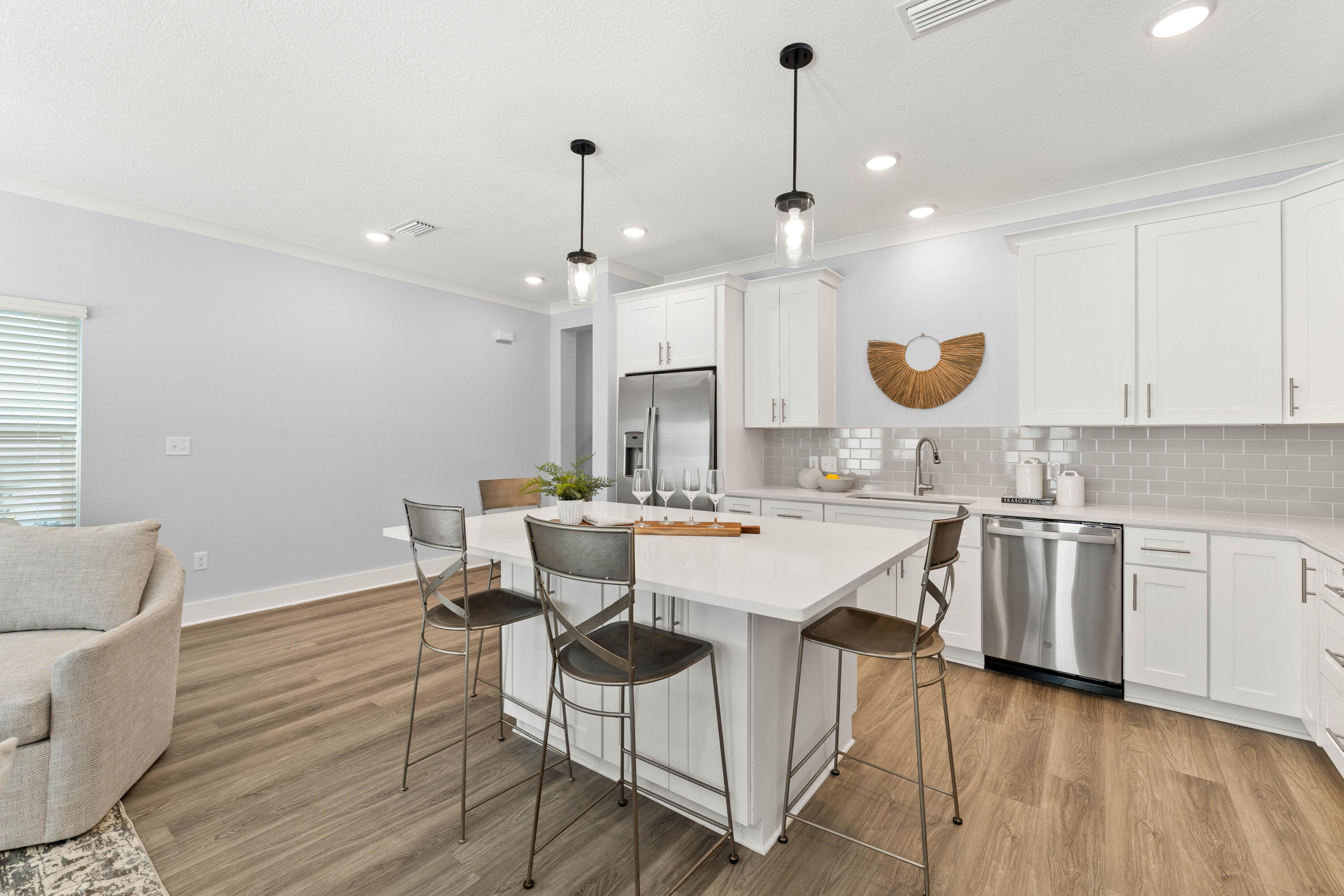 100 Beach Drive, Unit 9 Destin, FL 32541 - Photo 12 of 33 a large kitchen with a table and chairs