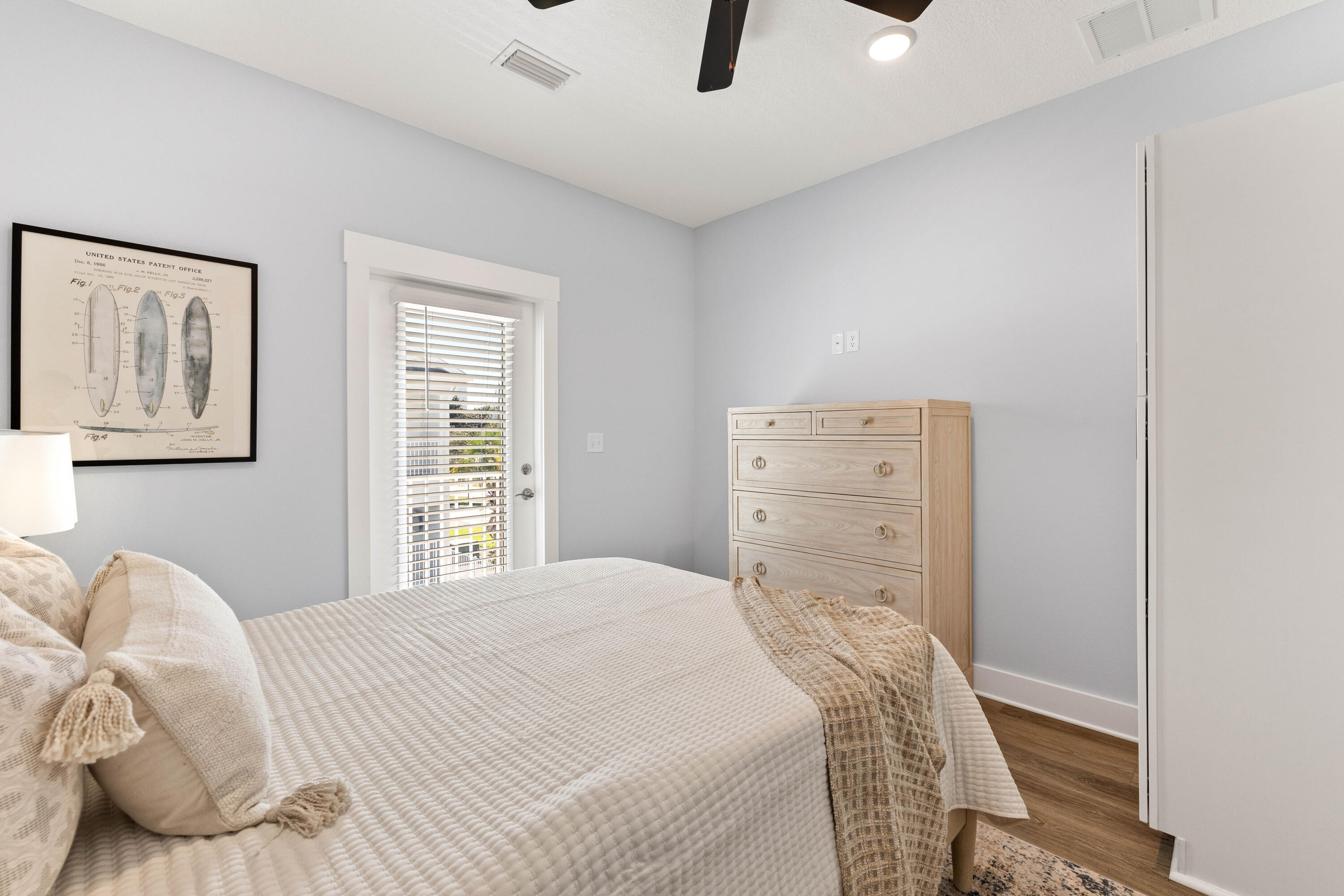 100 Beach Drive, Unit 9 Destin, FL 32541 - Photo 28 of 33 a bedroom with a bed and a couch