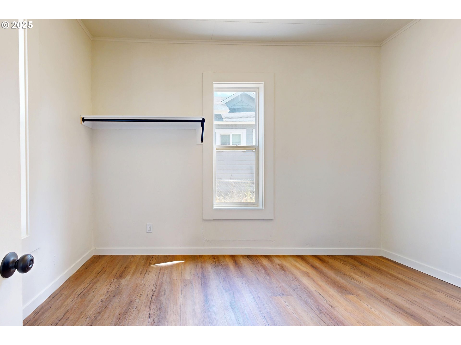 611 Southwest 3rd Street Pendleton, OR 97801 - Photo 11 of 22 a view of an empty room with wooden floor and a window