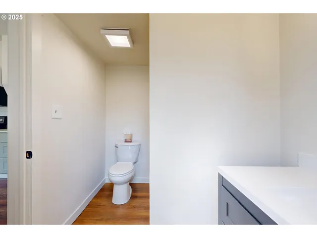 a bathroom with a toilet and a sink