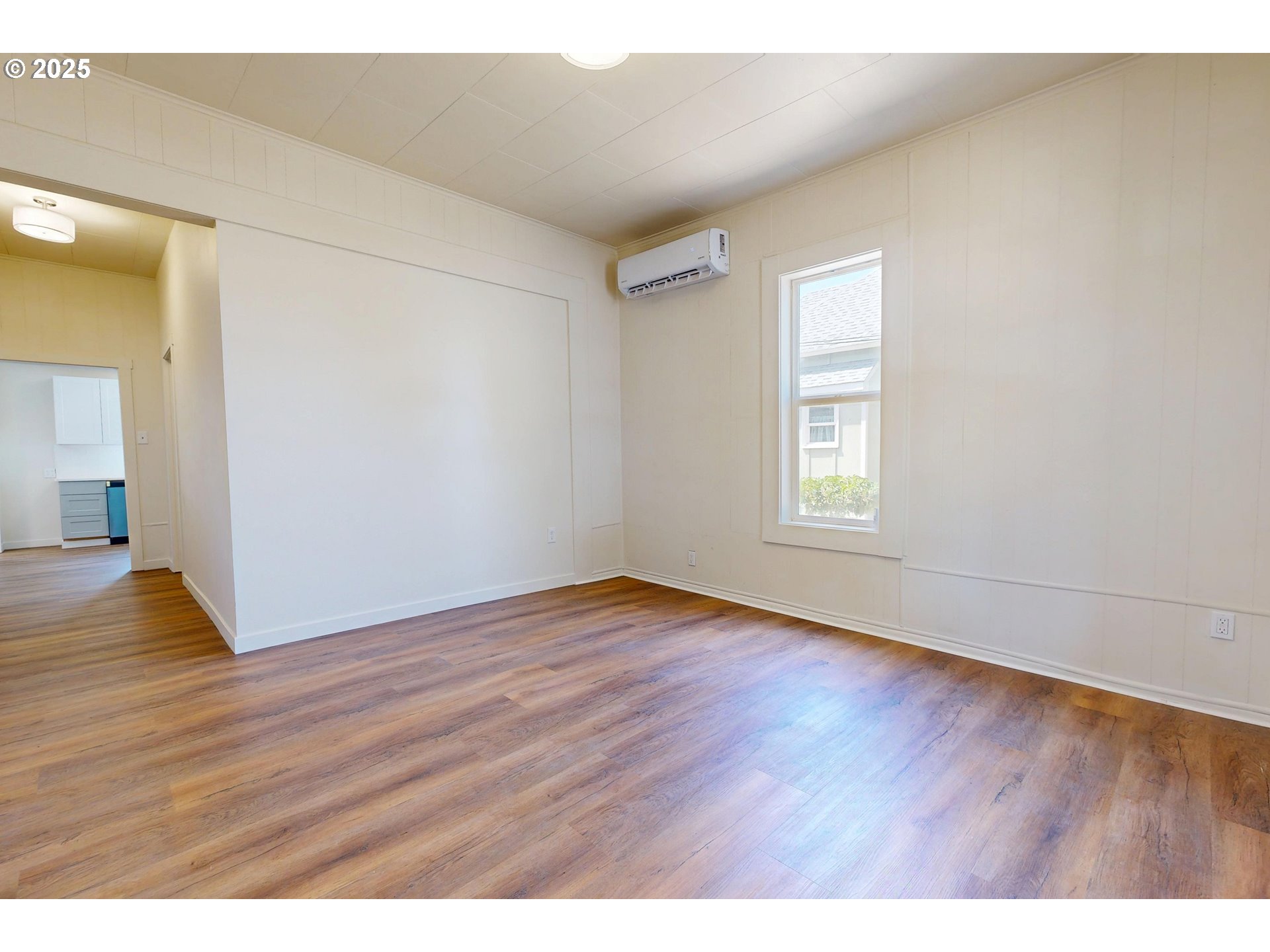 611 Southwest 3rd Street Pendleton, OR 97801 - Photo 2 of 22 a view of an empty room with wooden floor and a window