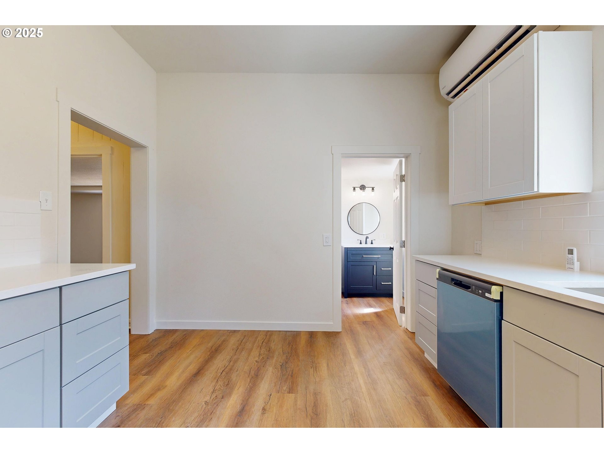 611 Southwest 3rd Street Pendleton, OR 97801 - Photo 8 of 22 a kitchen with cabinets and wooden floor