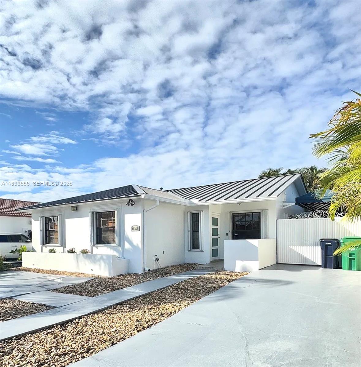 a front view of a house with a space and a garage