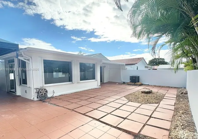 a view of a backyard of the house