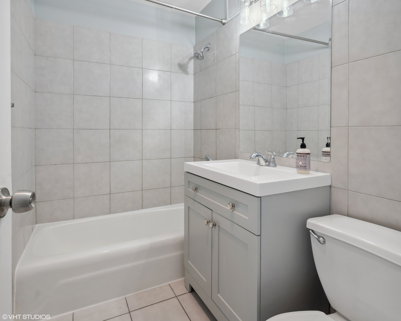 655 West Irving Park Road, Unit 3707 Chicago, IL 60613 - Photo 4 of 13 a bathroom with a sink toilet vanity and bathtub