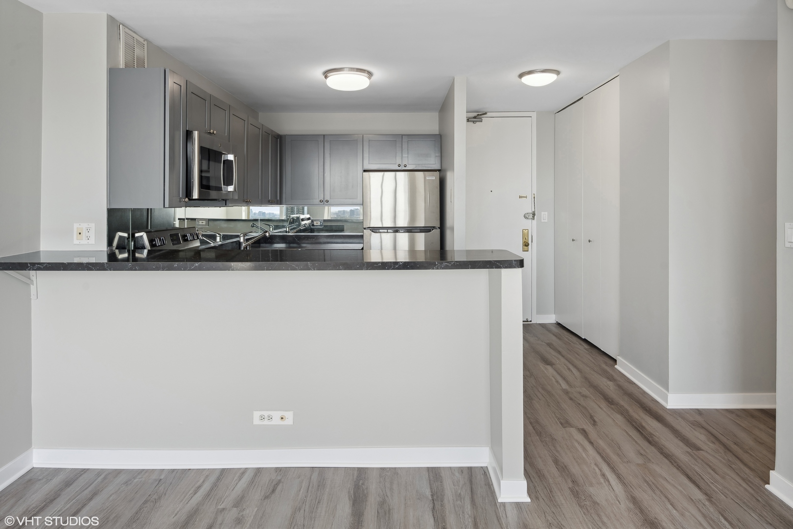 655 West Irving Park Road, Unit 3707 Chicago, IL 60613 - Photo 9 of 13 a view of a kitchen with wooden floor