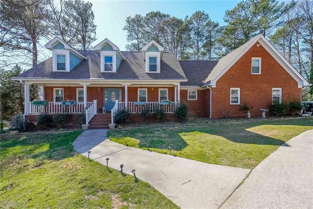 front view of a house with a yard