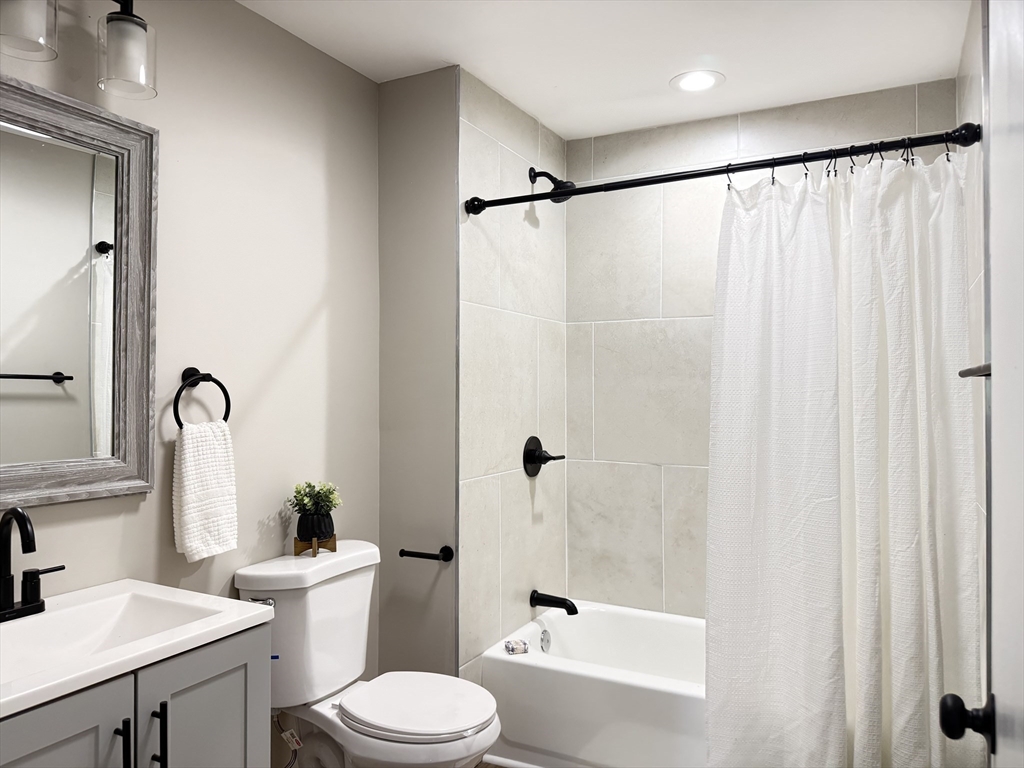 37 Bridge Street Monson, MA 01057 - Photo 11 of 35 a white toilet sitting next to a bathroom sink