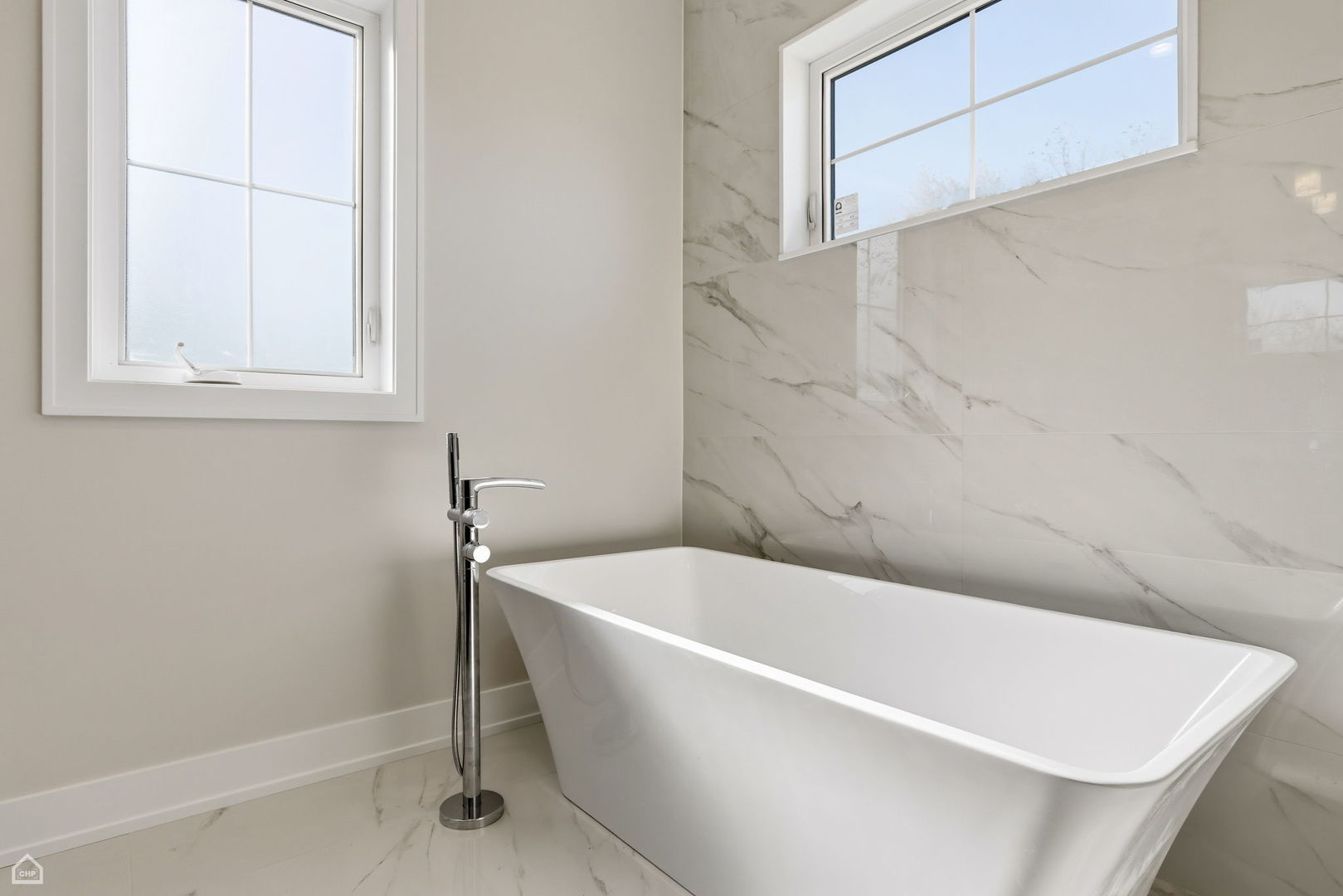 1220 Courtland Avenue Park Ridge, IL 60068 - Photo 18 of 32 a white bath tub sitting in a bathroom