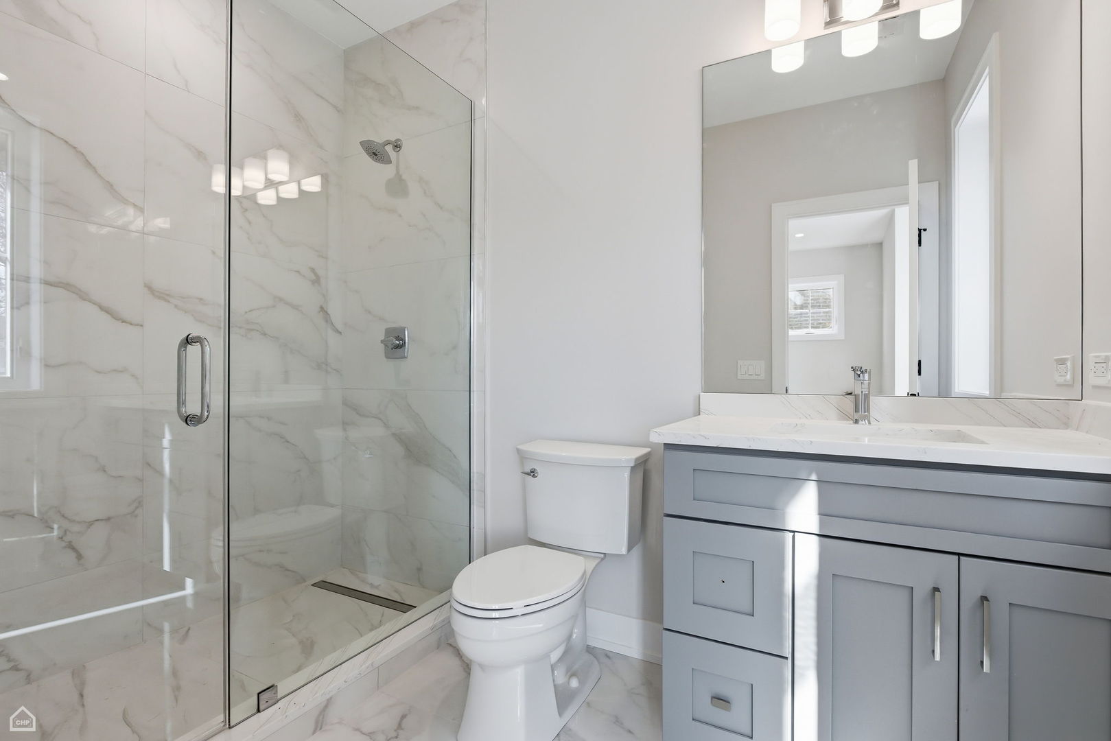 1220 Courtland Avenue Park Ridge, IL 60068 - Photo 24 of 32 a bathroom with a sink a toilet and shower