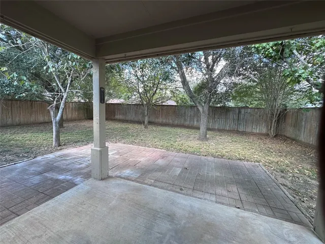 a view of a back yard with tree s