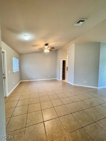 a view of an empty room and window
