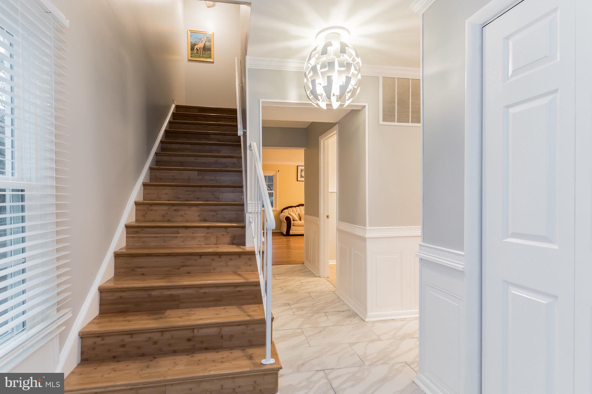 6401 Silver Ridge Circle Alexandria, VA 22315 - Photo 15 of 29 Hardwood Stairs leading Upstairs from Foyer Entry
