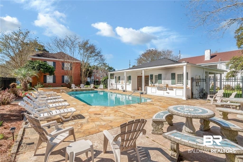 214 Upham Street, Unit 3D Mobile, AL 36607 - Photo 29 of 34 Community pool with a patio area and a grill
