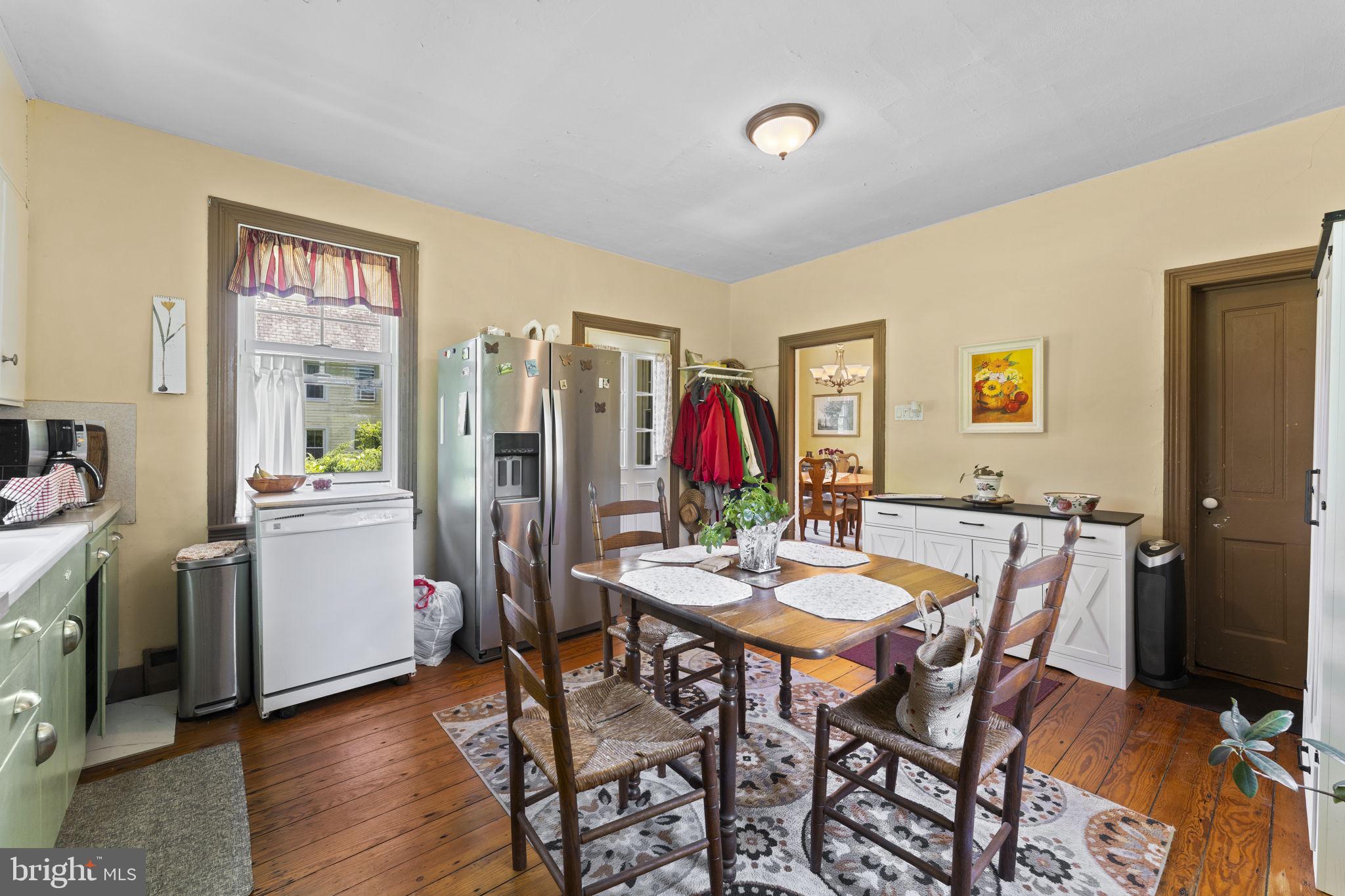9039 Easton Road Ottsville, PA 18942 - Photo 13 of 61 a view of a dining room with furniture and wooden floor