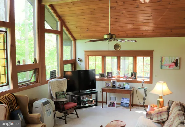 a room with counter top space and painting on the wall