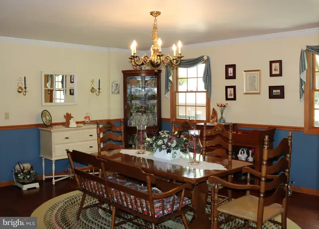 a bedroom with a bed a dresser and mirror