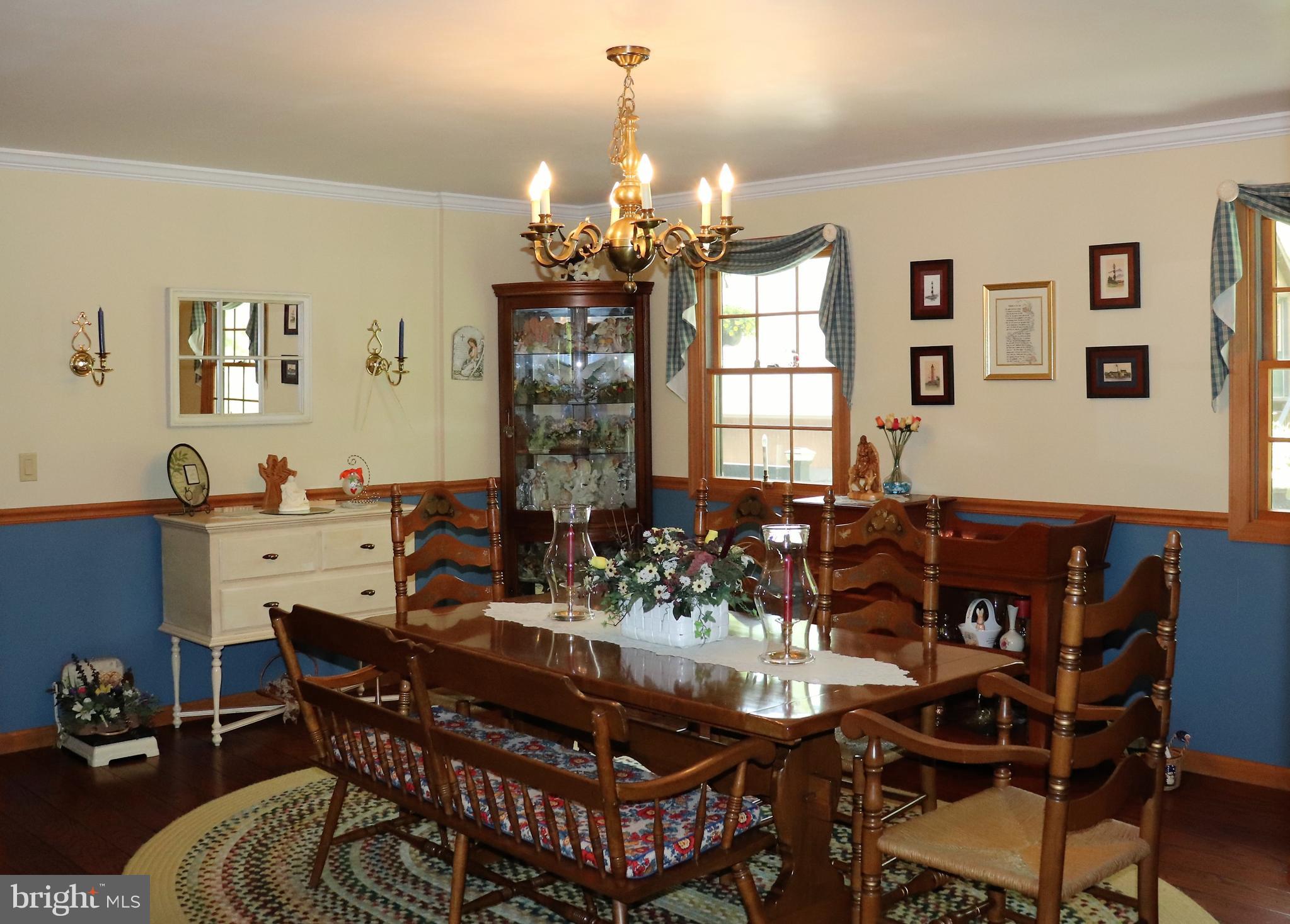 168 Cherry Tree Road Addison, PA 15411 - Photo 20 of 42 a view of a dining room with furniture and chandelier