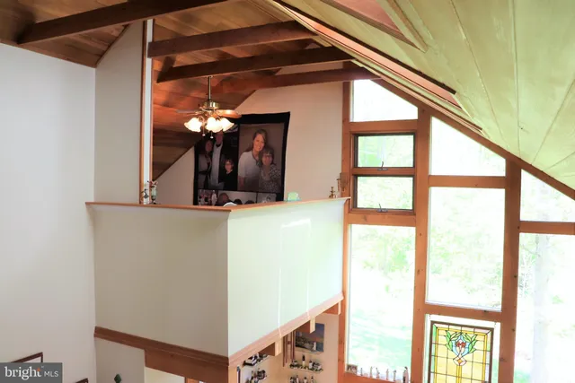 a view of a livingroom with furniture and a window