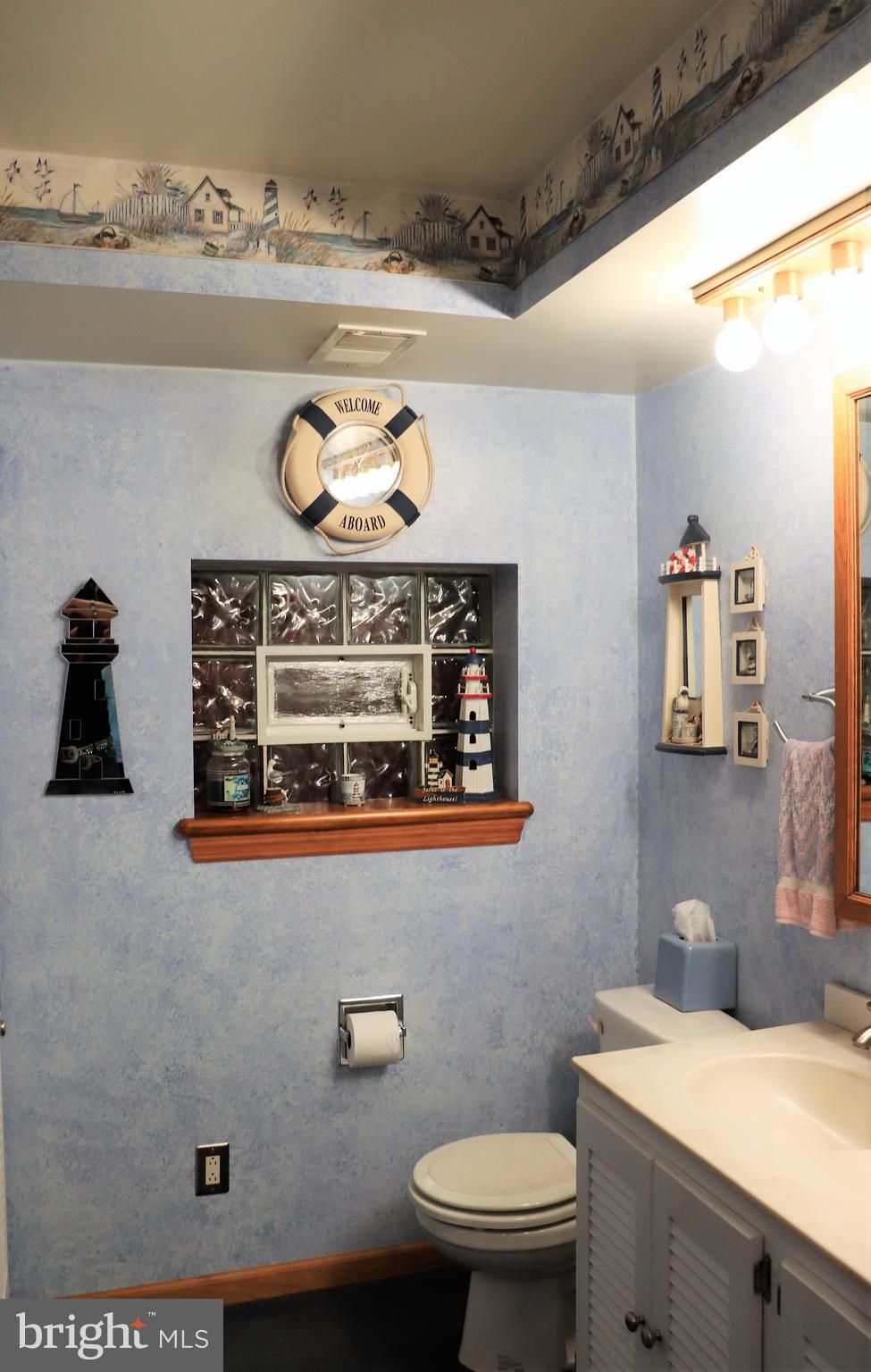 168 Cherry Tree Road Addison, PA 15411 - Photo 30 of 42 a bathroom with a sink a toilet and vanity