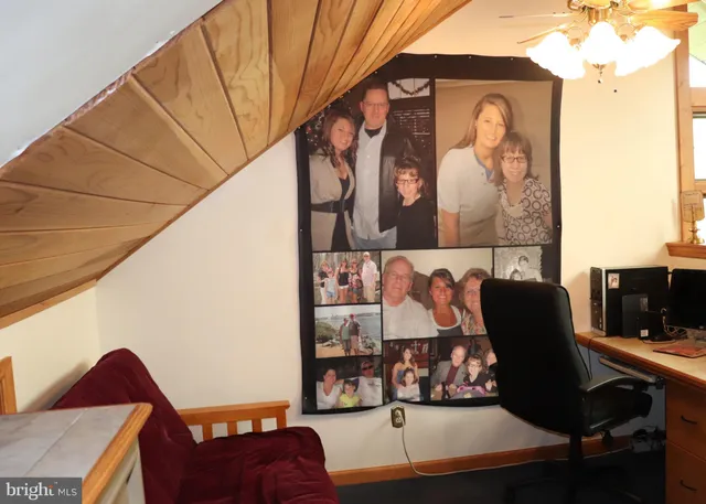 a bedroom with two beds and a chandelier