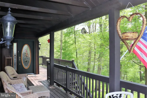 a front view of a house with a garden and plants