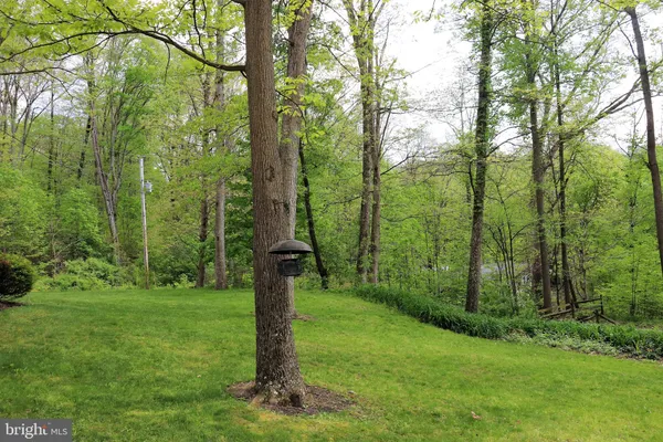 an aerial view of a house with a lake view