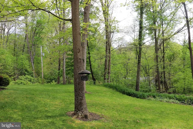 an aerial view of a house with a lake view