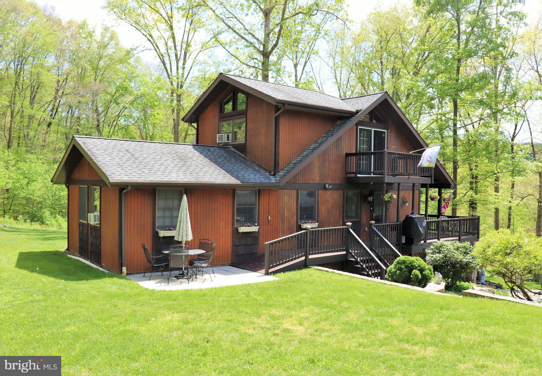 168 Cherry Tree Road Addison, PA 15411 - Photo 5 of 42 a front view of a house with a yard