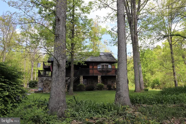 a view of a house with a tree and a tree