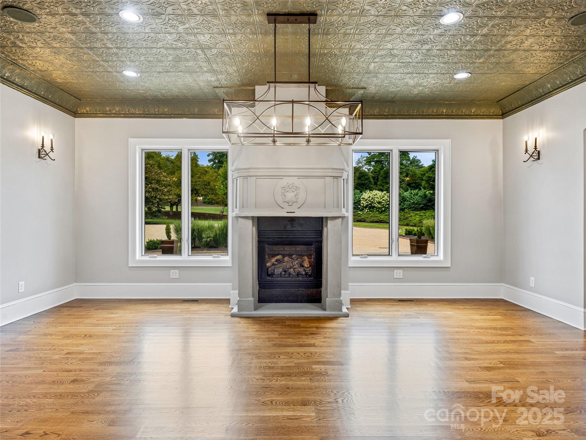 1090 Pearidge Road Bostic, NC 28018 - Photo 16 of 47 a view of an empty room with wooden floor and a fireplace