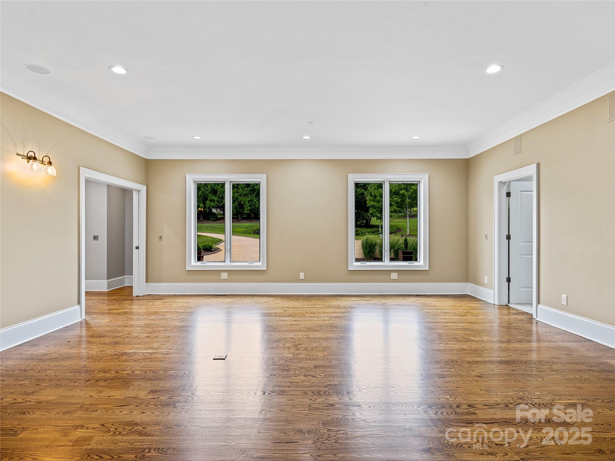 1090 Pearidge Road Bostic, NC 28018 - Photo 19 of 47 a view of an empty room with wooden floor and windows
