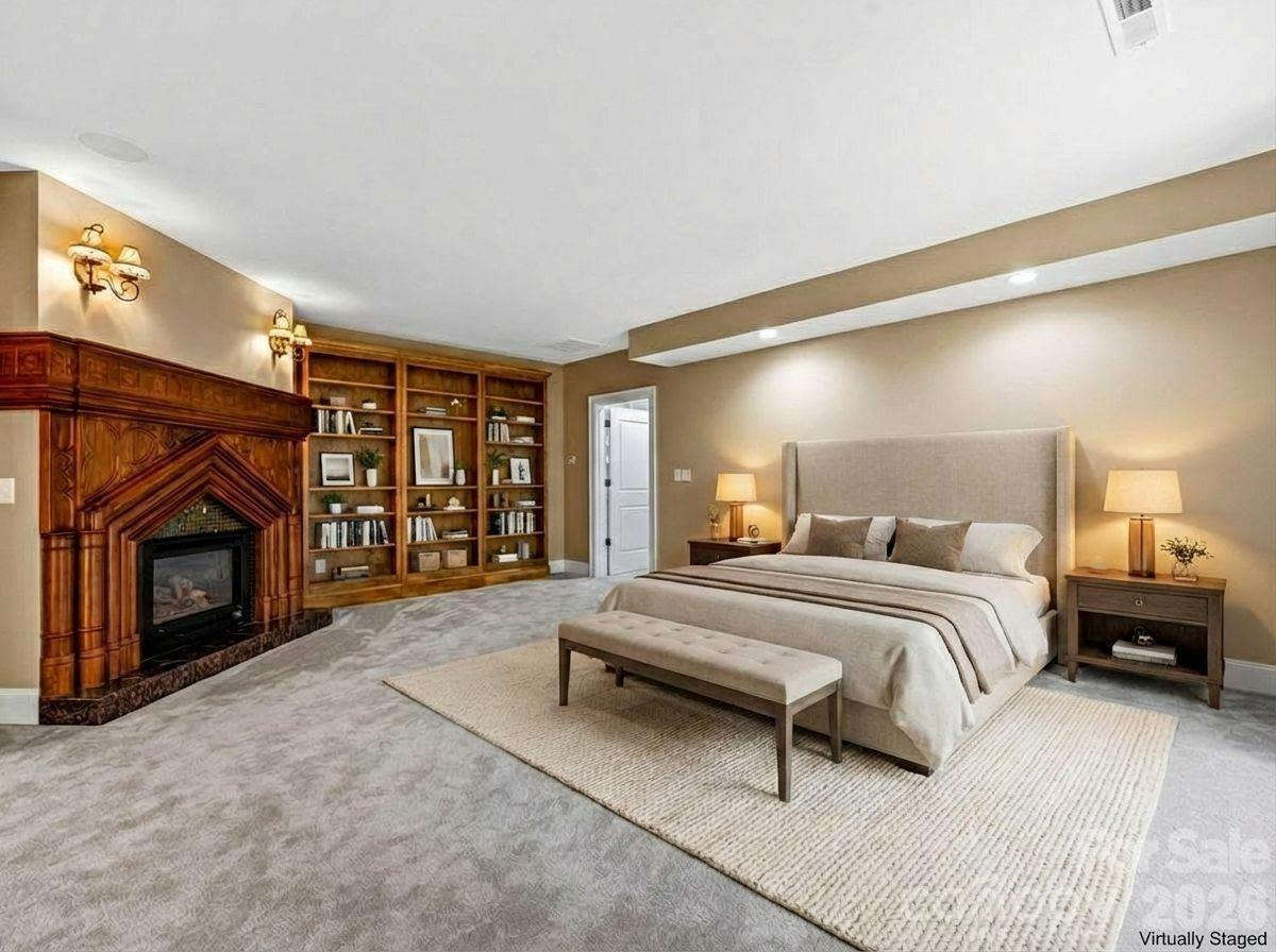 1090 Pearidge Road Bostic, NC 28018 - Photo 19 of 47 a spacious bedroom with a bed and a fireplace