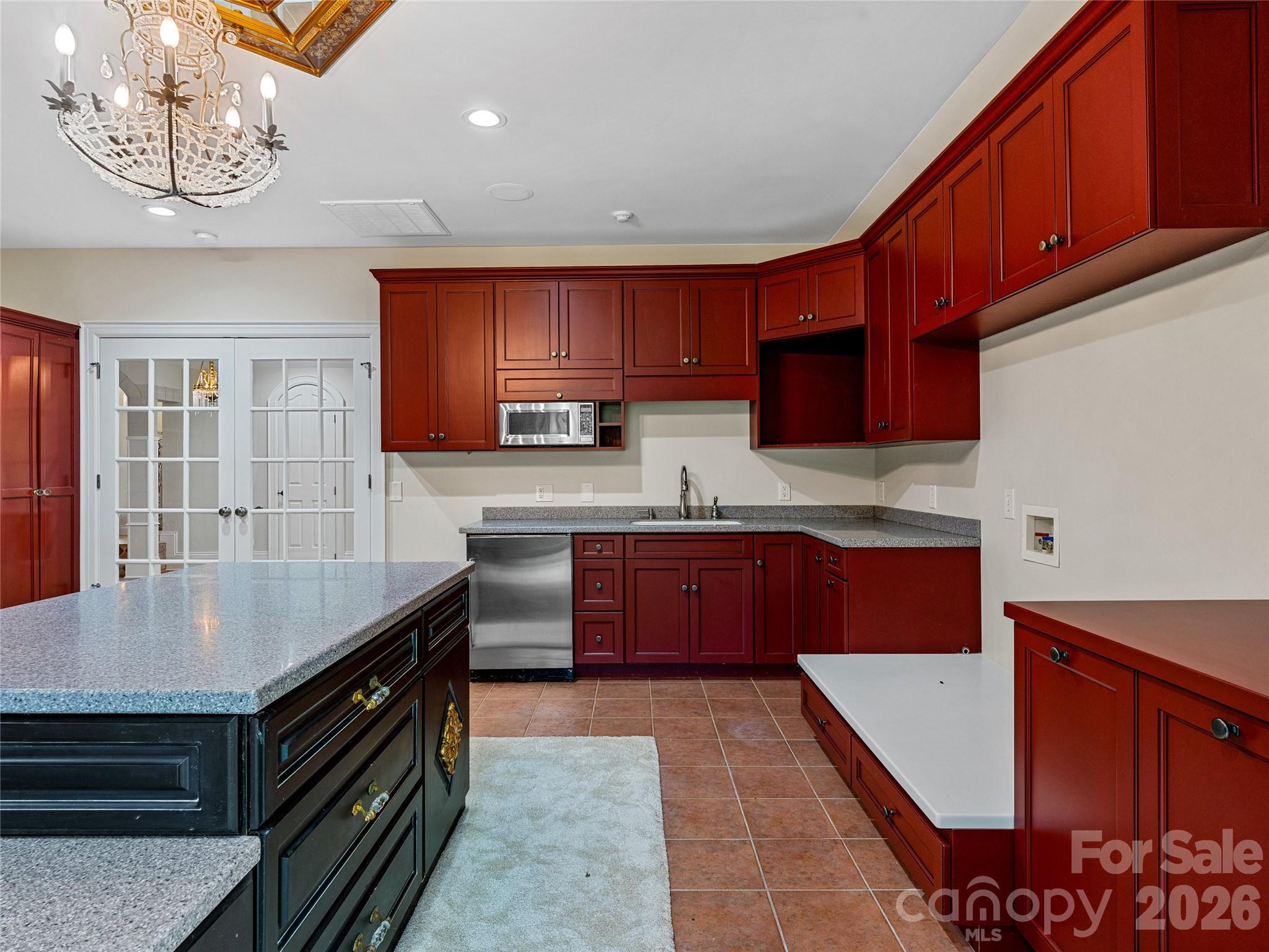 1090 Pearidge Road Bostic, NC 28018 - Photo 29 of 47 a kitchen with stainless steel appliances granite countertop a stove a sink dishwasher and a refrigerator with wooden cabinets