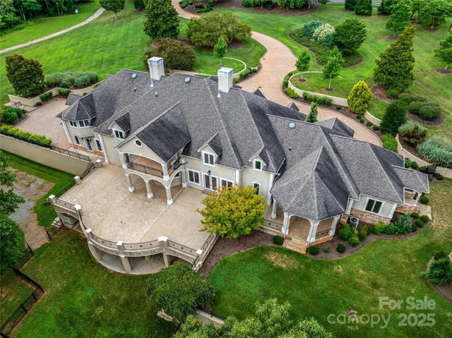 an aerial view of a house with outdoor space