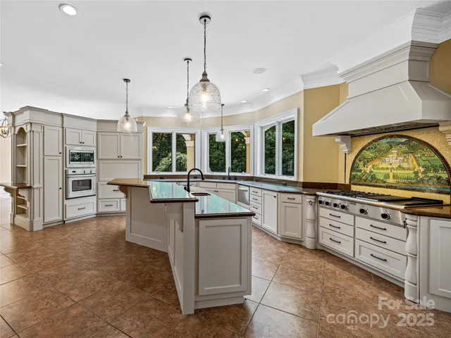 a kitchen with counter top space and stainless steel appliances