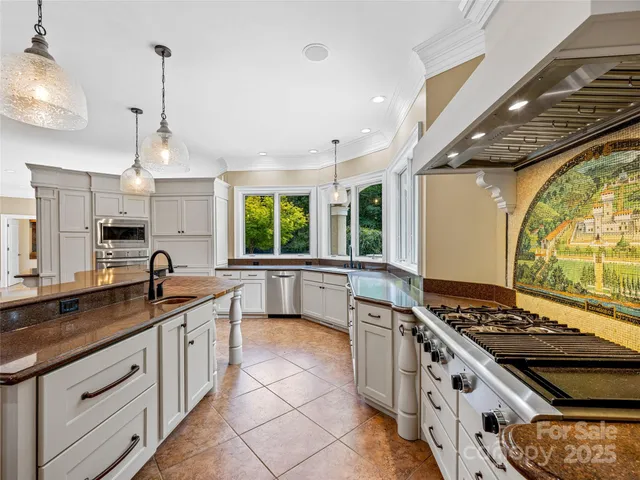 a kitchen with stove a sink and cabinets