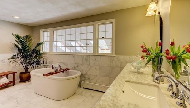 a bathroom with a bathtub and sink