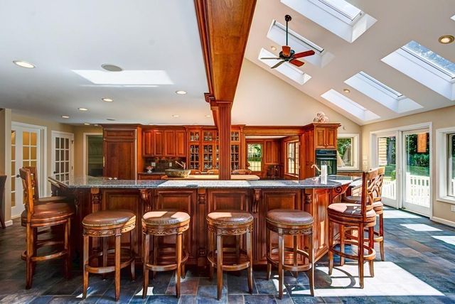 a dining table with chairs and wooden floor