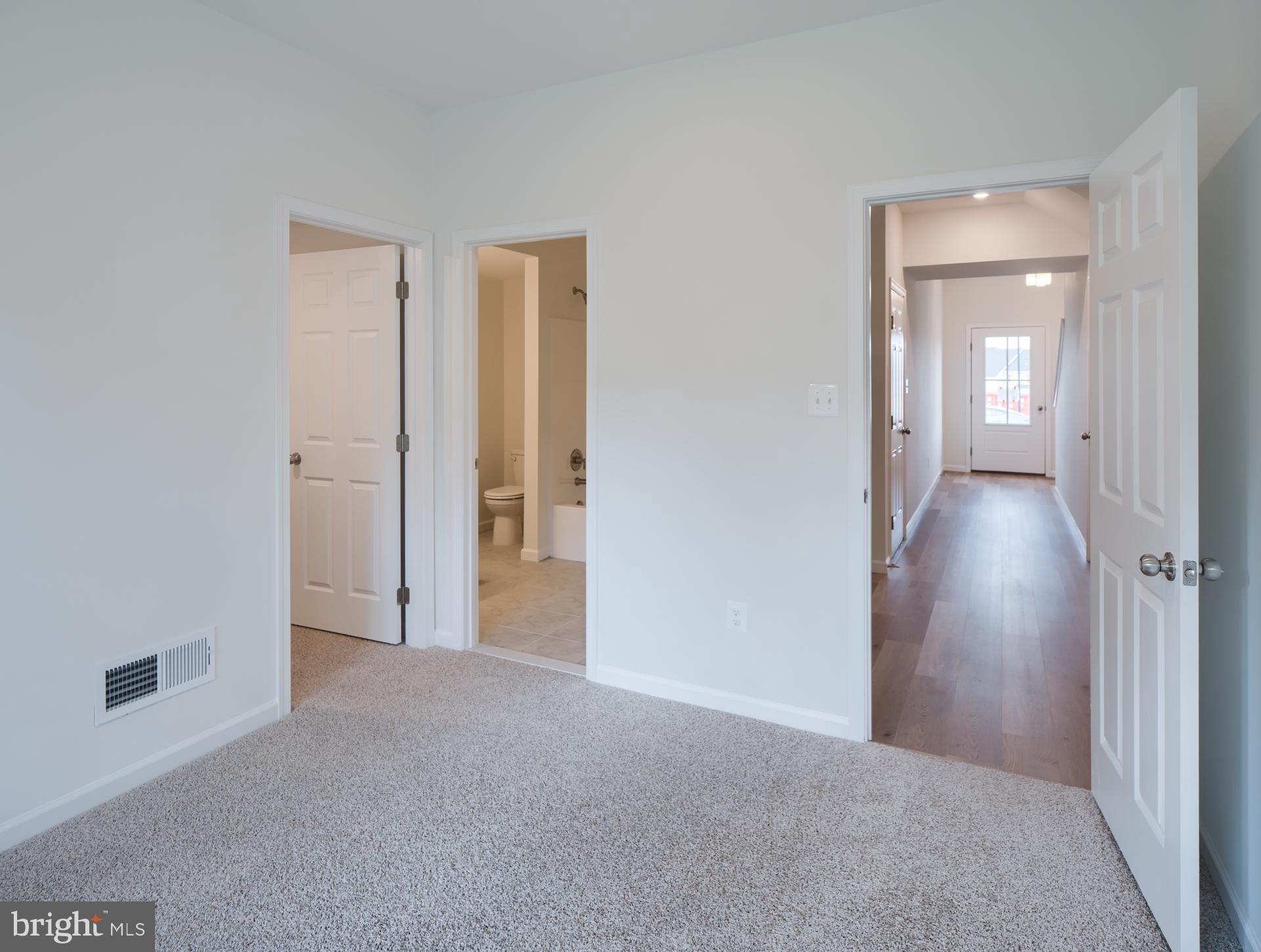 2609 Front Shed Drive Frederick, MD 21702 - Photo 11 of 78 a view of a room with an empty space and a hallway