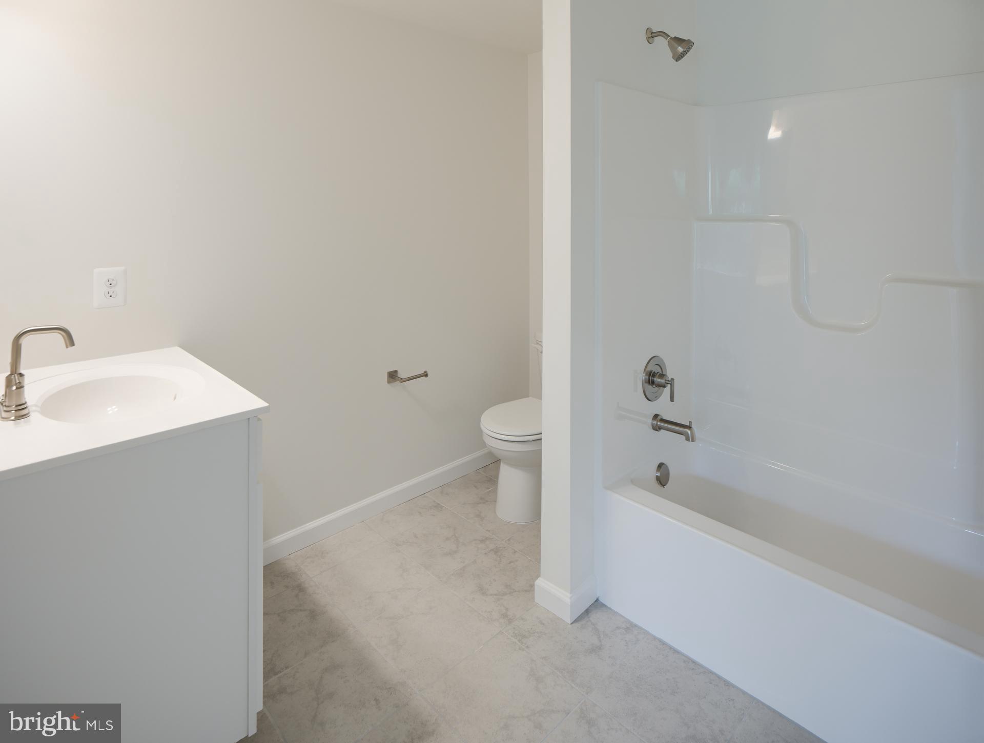 2609 Front Shed Drive Frederick, MD 21702 - Photo 14 of 78 a bathroom with a sink a toilet and shower