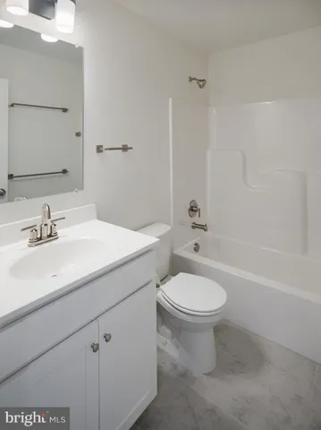 a living room with furniture fireplace and flat screen tv